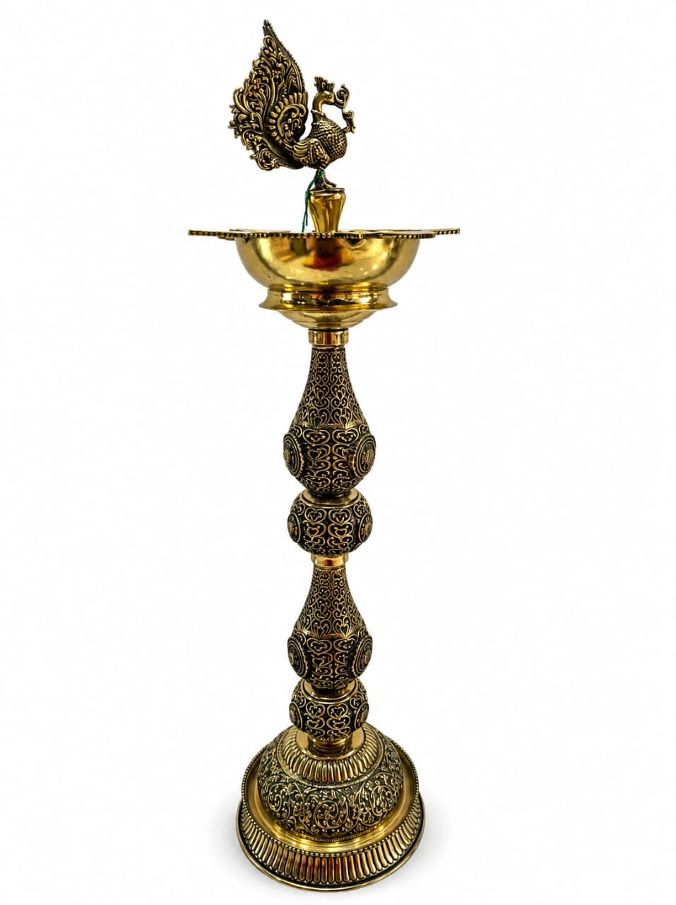 Pair of large brass lamps with detailed peacock figurines on top