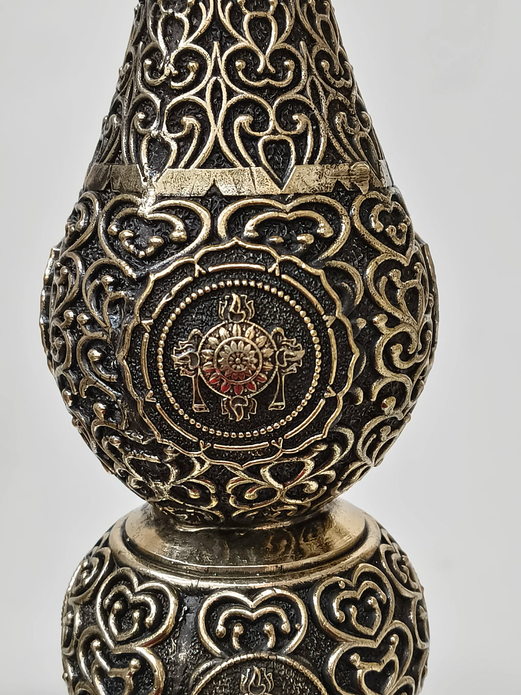 Close-up of ornate brass royal peacock lamp with intricate filigree designs