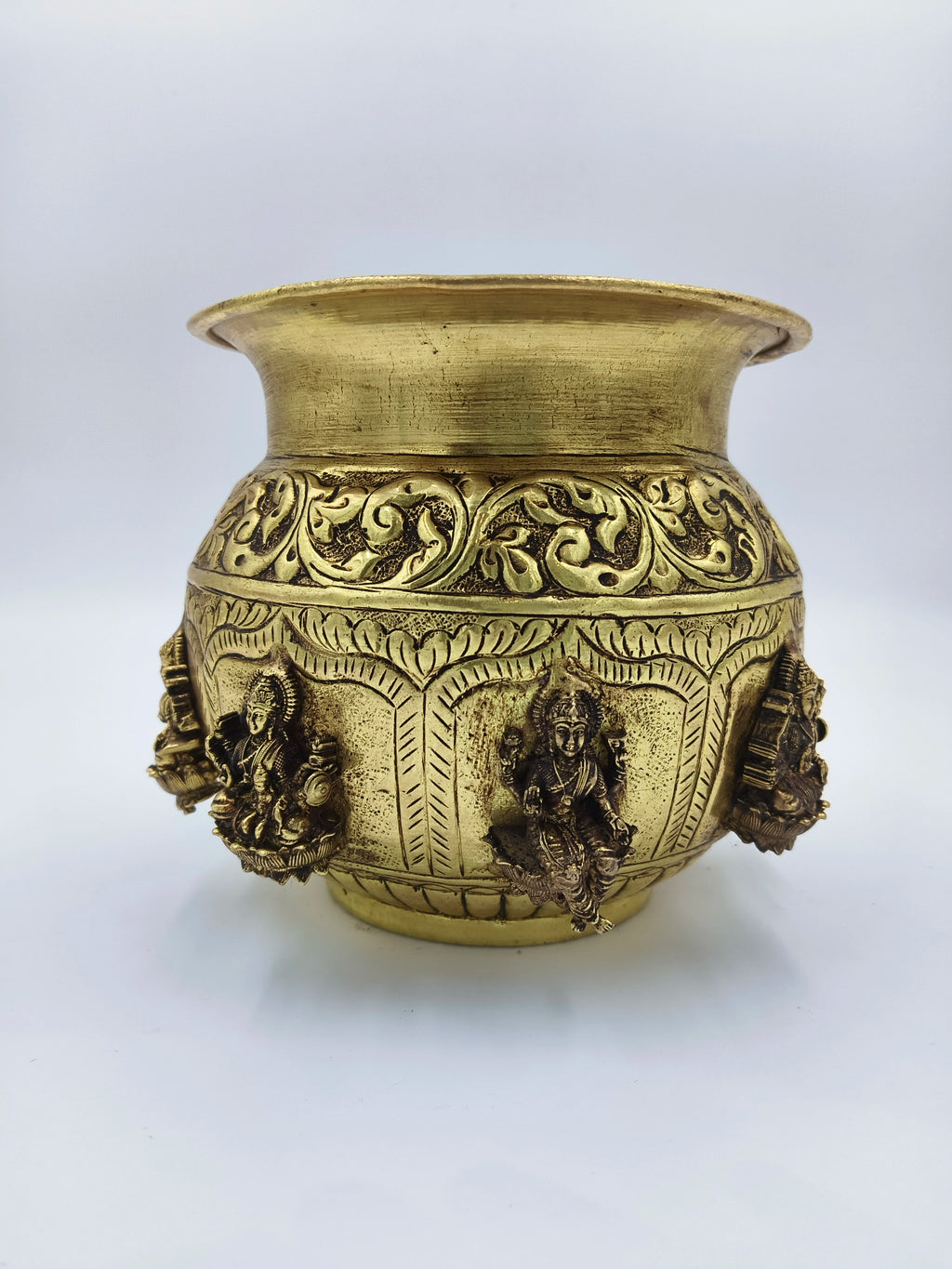 Medium brass Ashtalakshmi Kalash with intricate floral carvings and goddess figurines