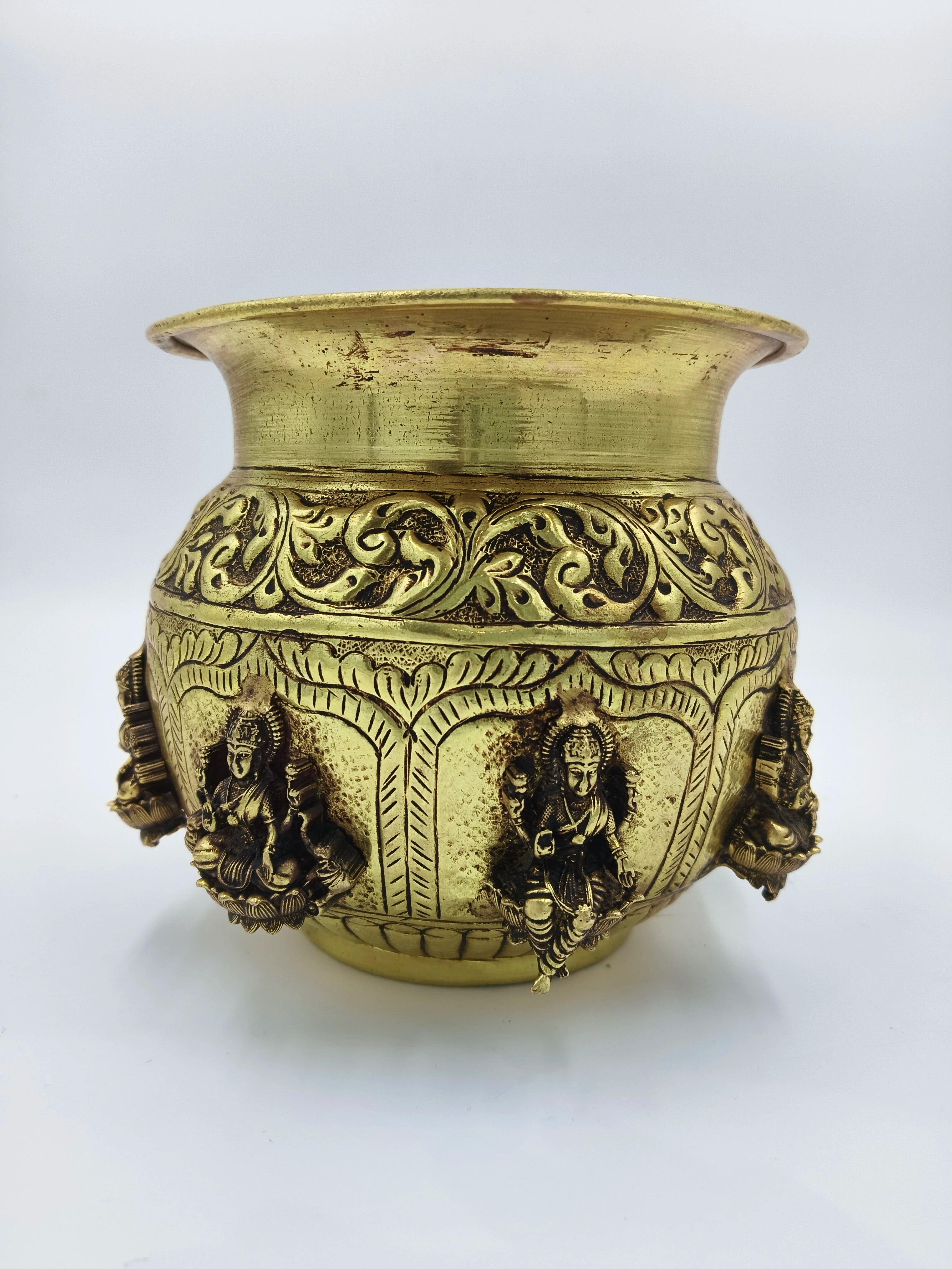 Medium brass Ashtalakshmi Kalash with intricate deity and floral designs