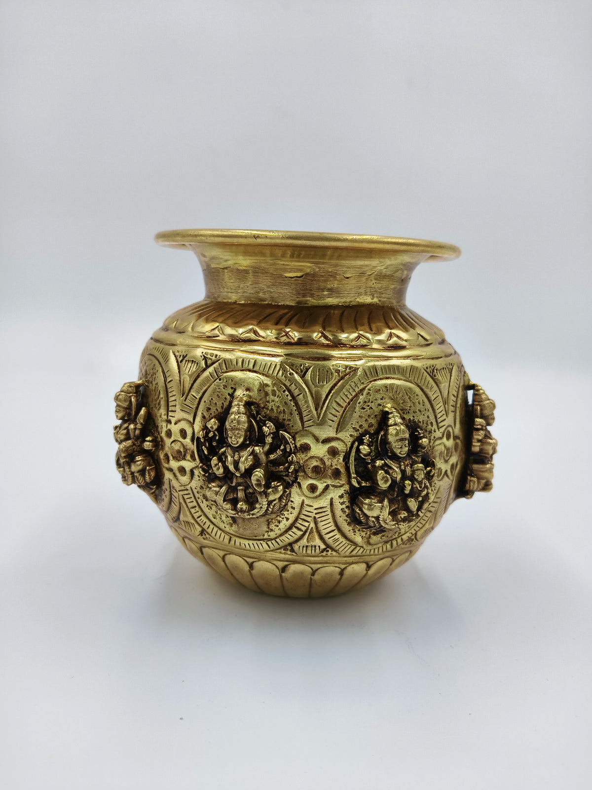 Small brass Ashtalakshmi kalash with detailed deity engravings