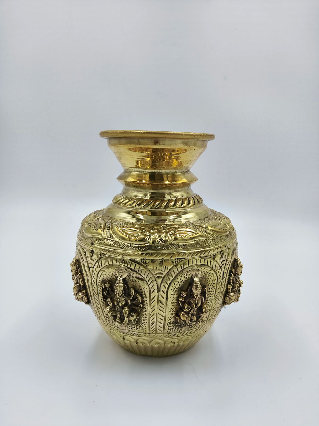 Medium brass Ashtalakshmi kalash with embossed deity figures and decorative patterns