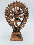 Copper brass sculpture of dancing Nataraja deity in ornate circular frame