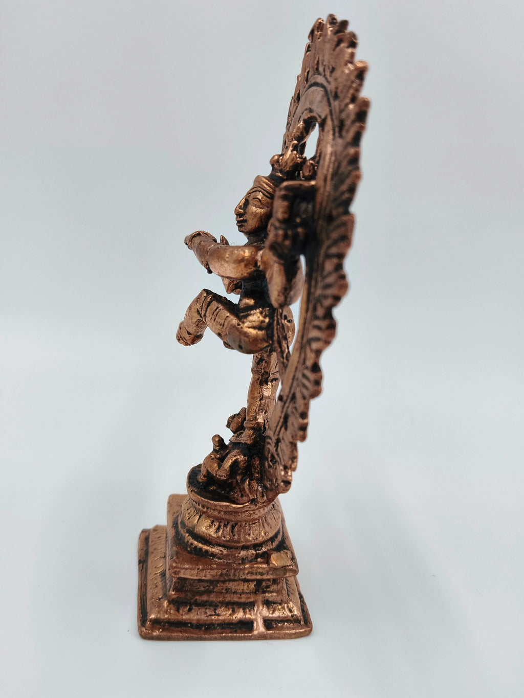 Side view of a medium-sized copper Nataraja brass sculpture on a square base