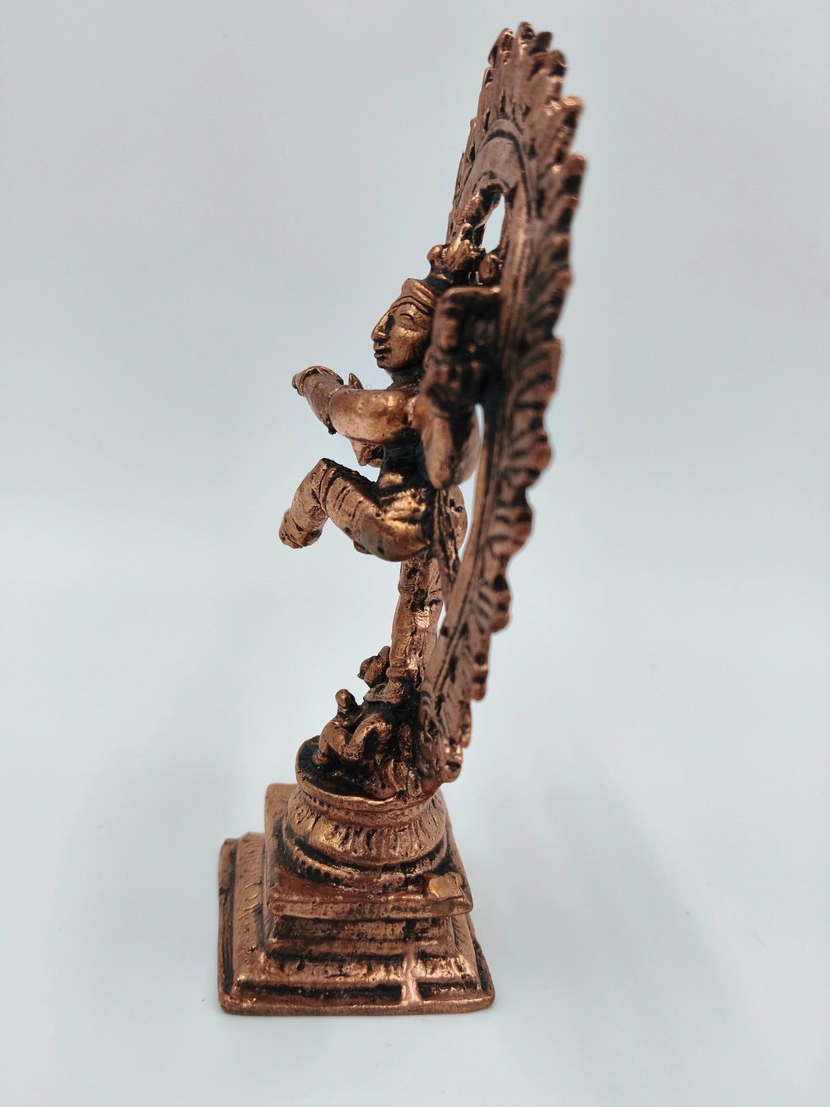Side view of a medium-sized copper Nataraja brass sculpture on a square base