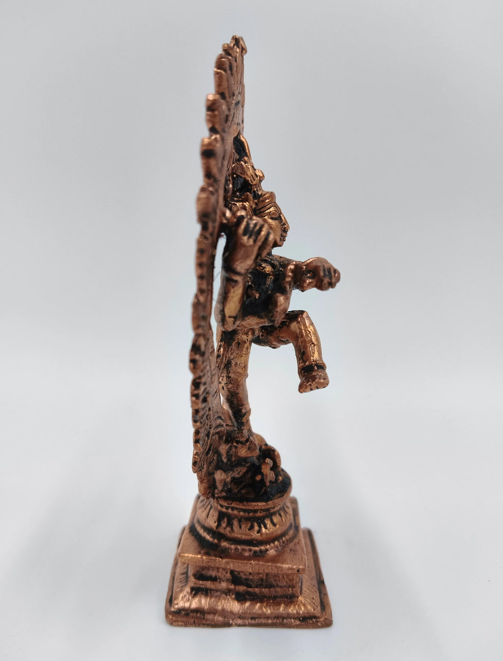 Side view of a medium-sized copper Nataraja brass sculpture on square base