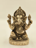 Medium brass statue of Ganesh sitting with four arms holding symbolic objects