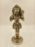 Large brass figurine of Hanuman holding a mace, standing on a decorative base