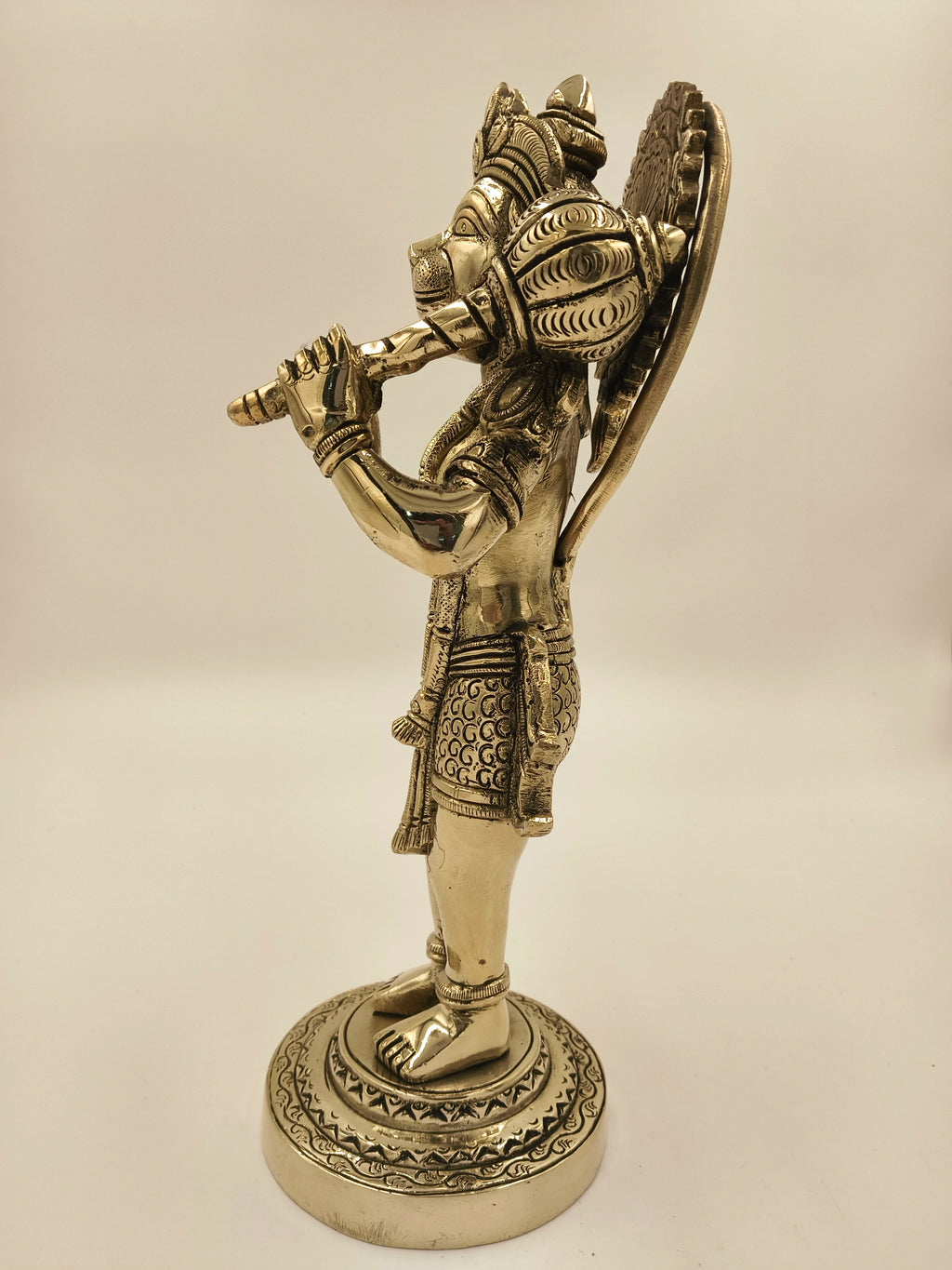 Large brass Rama Dhoota Hanuman figurine playing flute, side view
