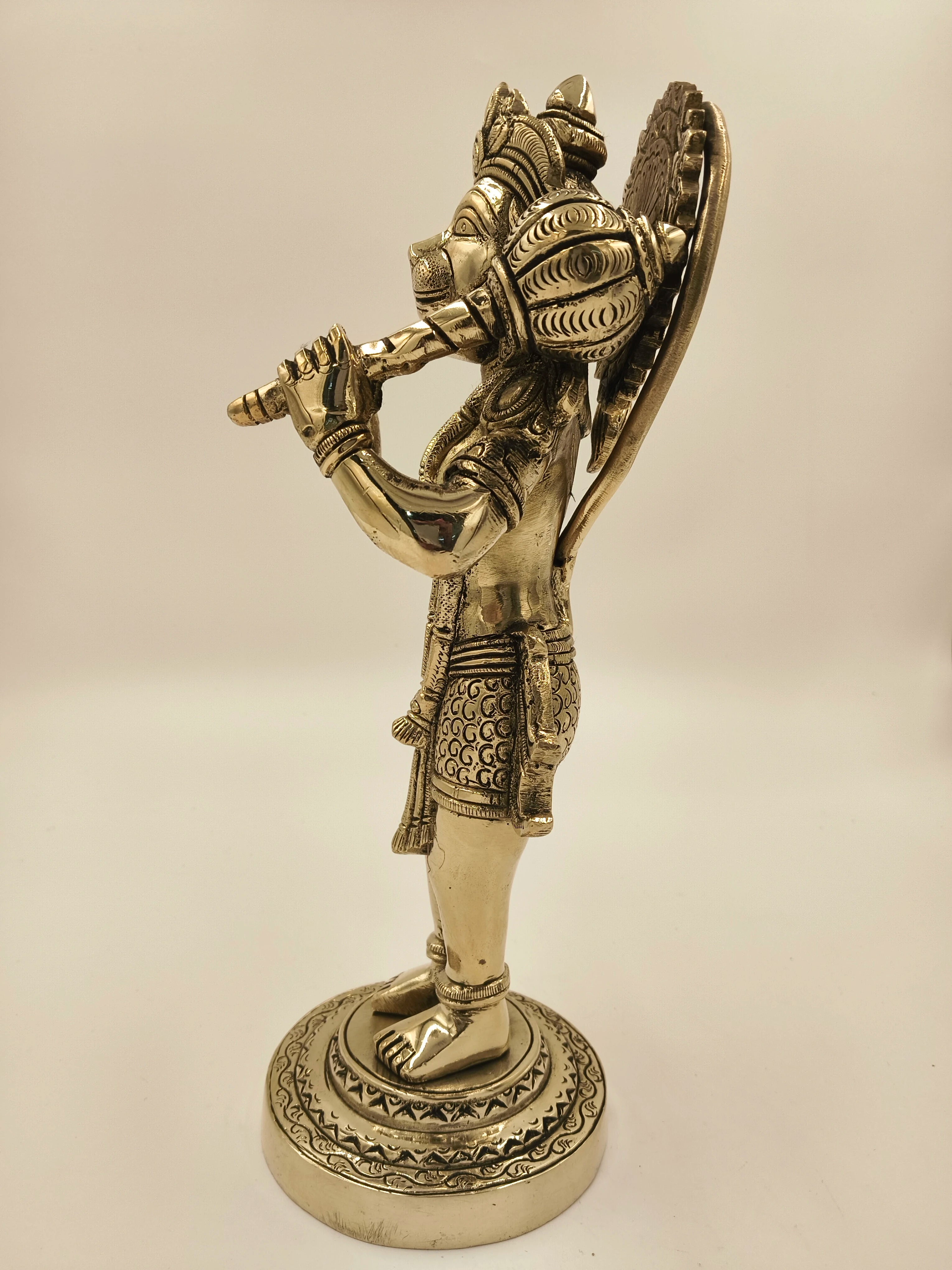 Large brass Rama Dhoota Hanuman figurine playing flute, side view