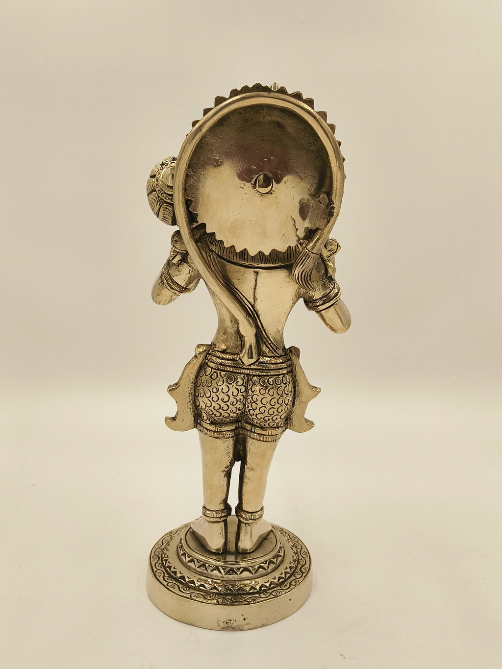 Back view of large brass Rama Dhoota Hanuman sculpture on decorative base