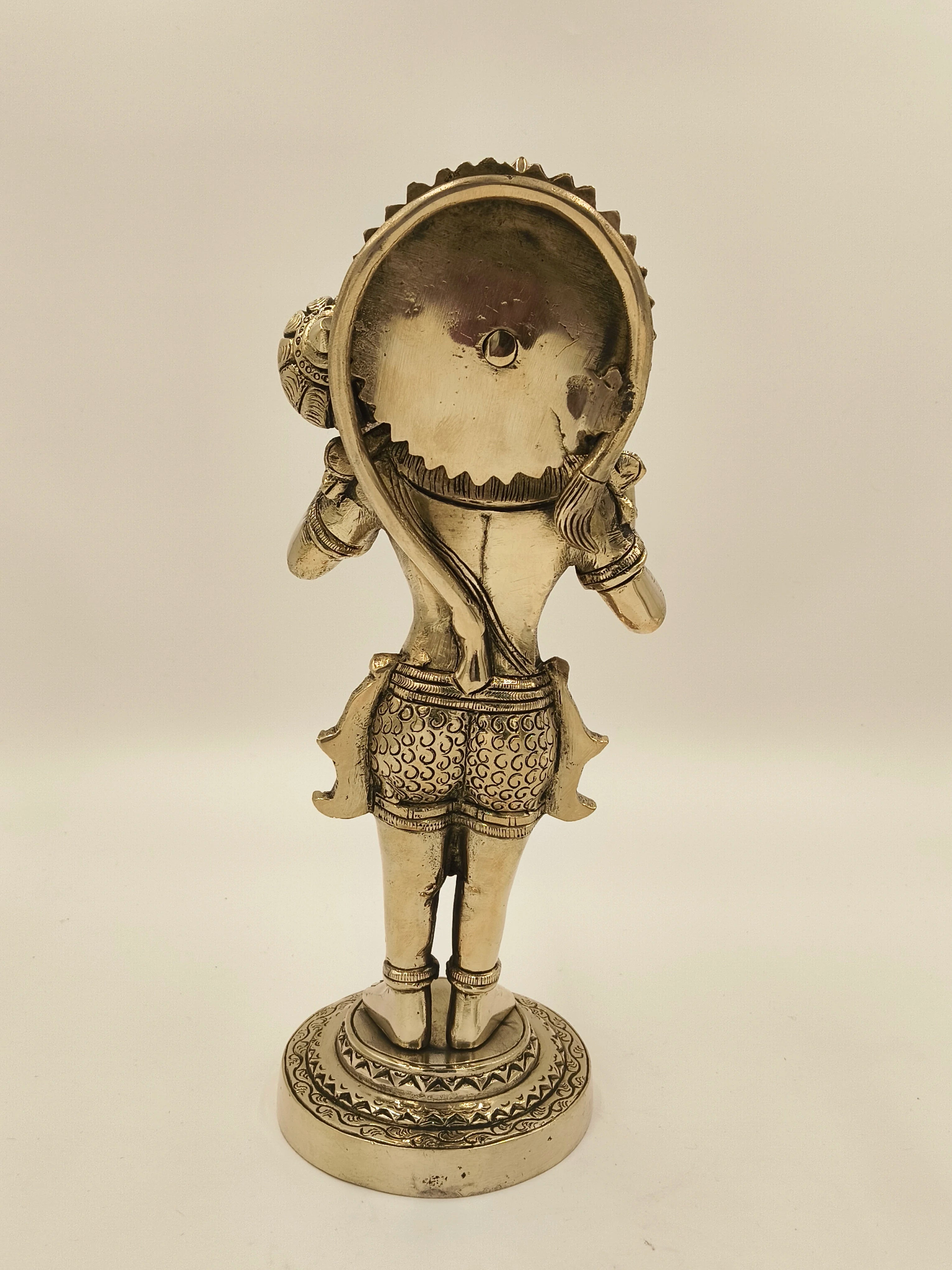 Back view of large brass Rama Dhoota Hanuman sculpture on decorative base