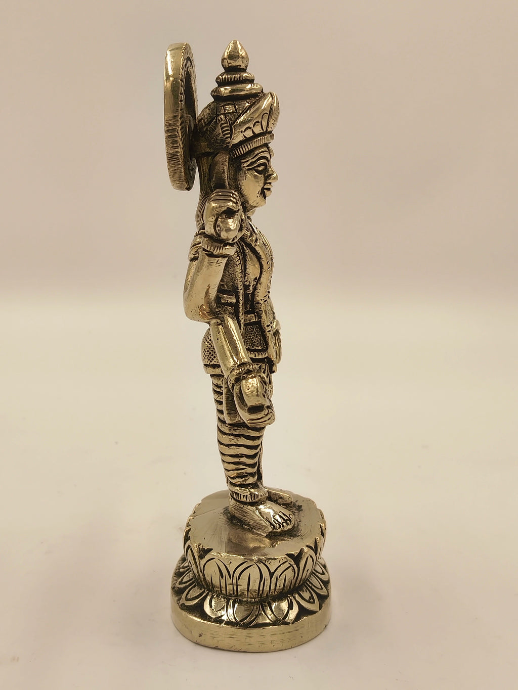 Side view of medium brass Narayana Vishnu statue with intricate detailing