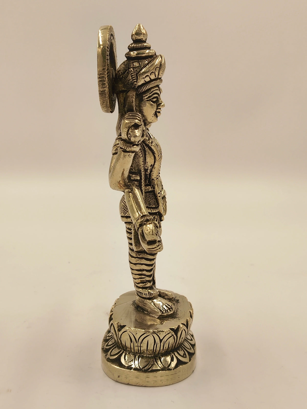 Side view of medium brass Narayana Vishnu statue with intricate detailing