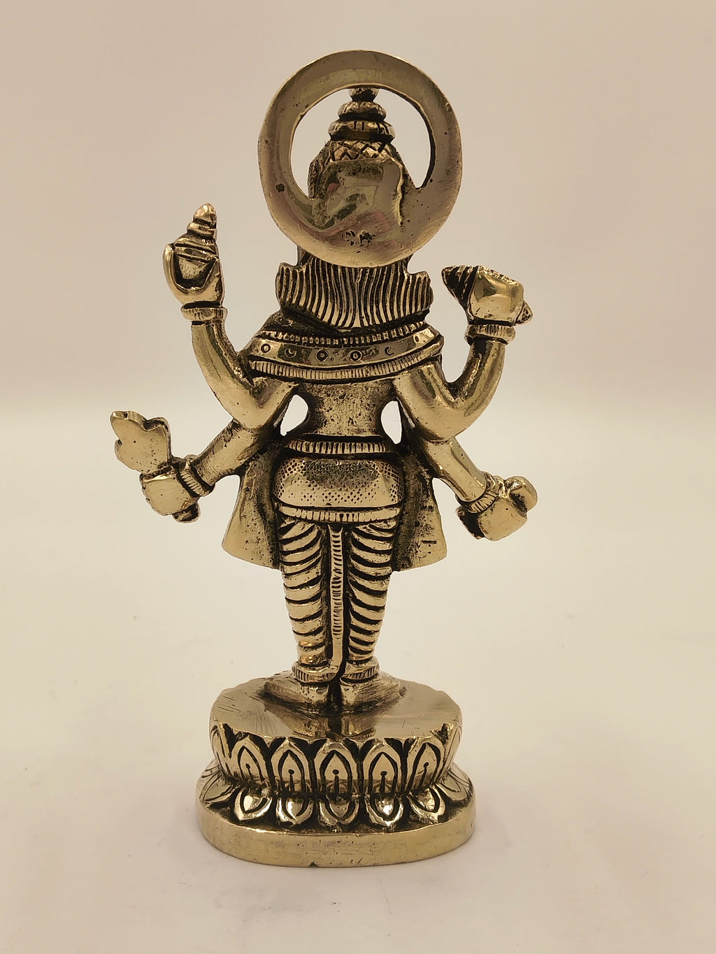 Back view of medium brass Narayana idol on lotus base