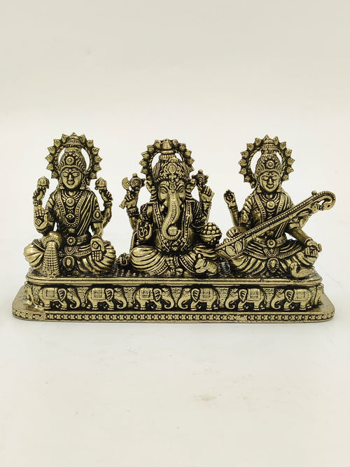 Mini brass sculpture of Lakshmi, Ganesh, and Saraswathi gods on engraved base