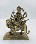Medium brass sculpture of Goddess Durga seated on a lion with multiple arms