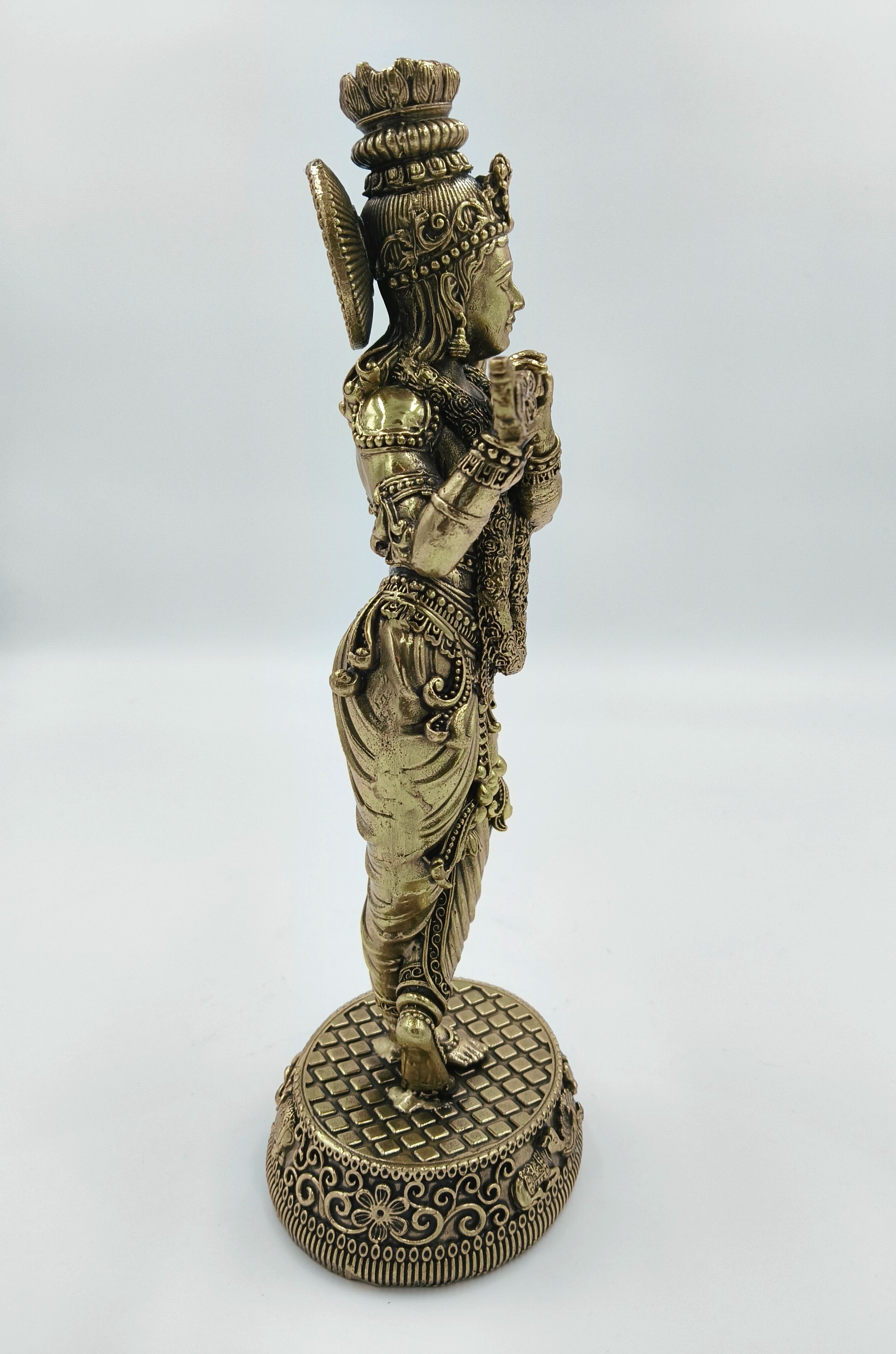 Side view of large brass Venumadhava Krishna statue with intricate detailing