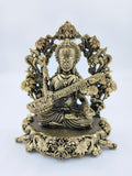 Medium brass sculpture of Goddess Saraswathi playing veena with floral ornate base
