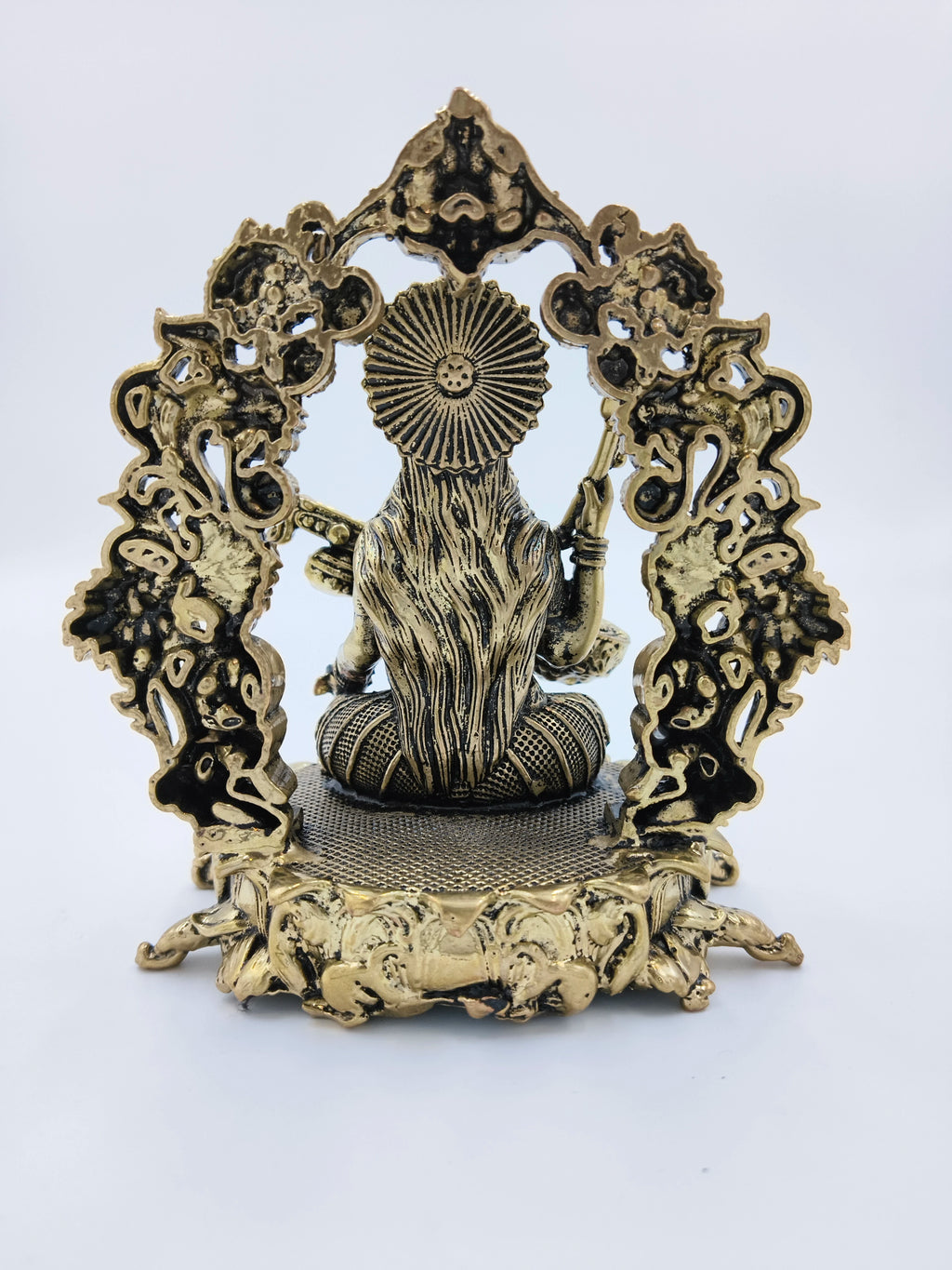 Rear view of medium brass Vagdevi Kalamurti sculpture depicting goddess Saraswathi