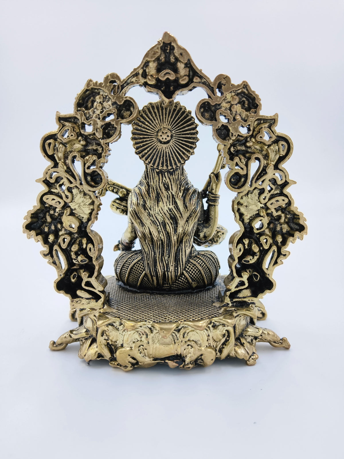 Rear view of medium brass Vagdevi Kalamurti sculpture depicting goddess Saraswathi