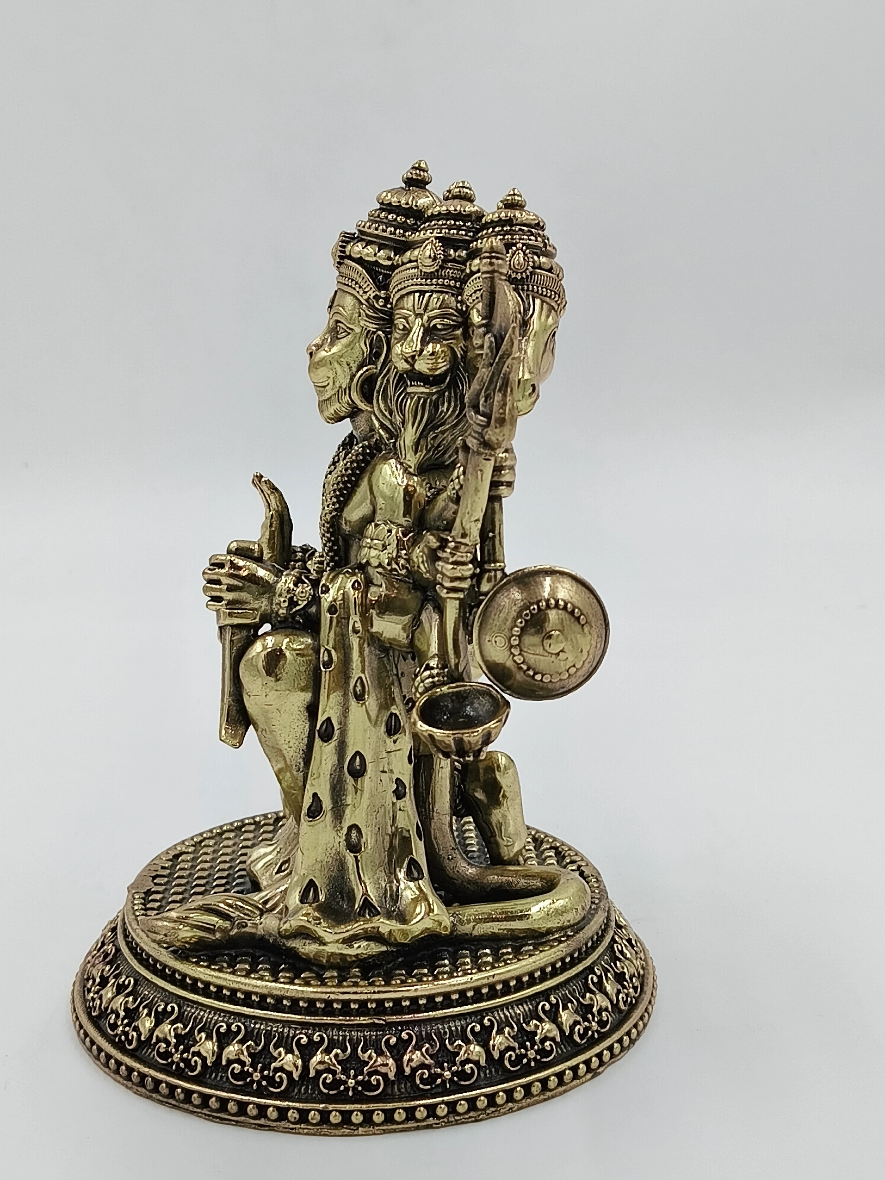 Medium brass Pancavaktra Mahaveer statue with five faces and detailed base
