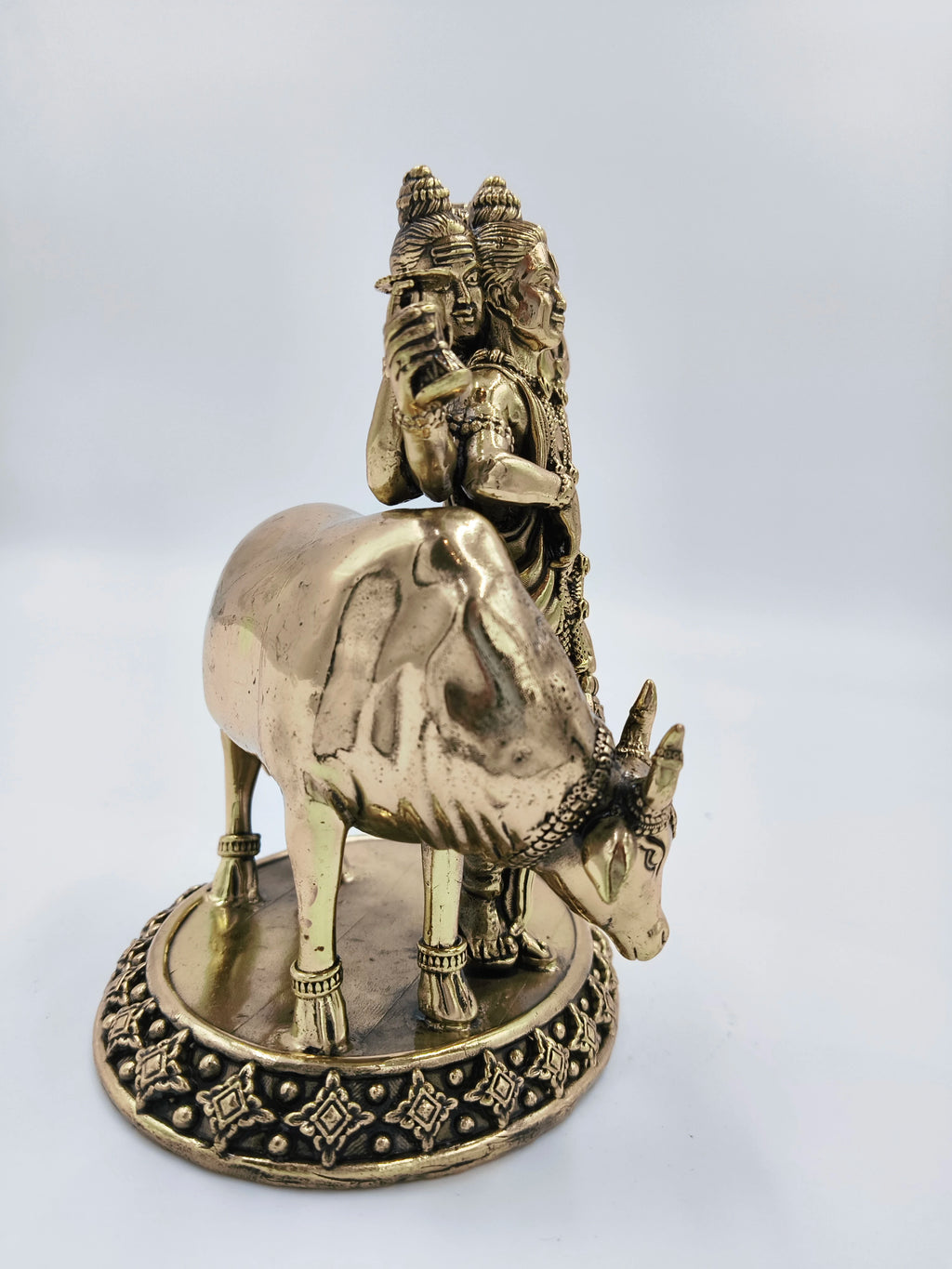 Medium brass statue of Dattatreya deity with sacred cow on decorative base