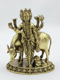 Brass sculpture of Dattatreya with three heads, cow, and dog on decorative base