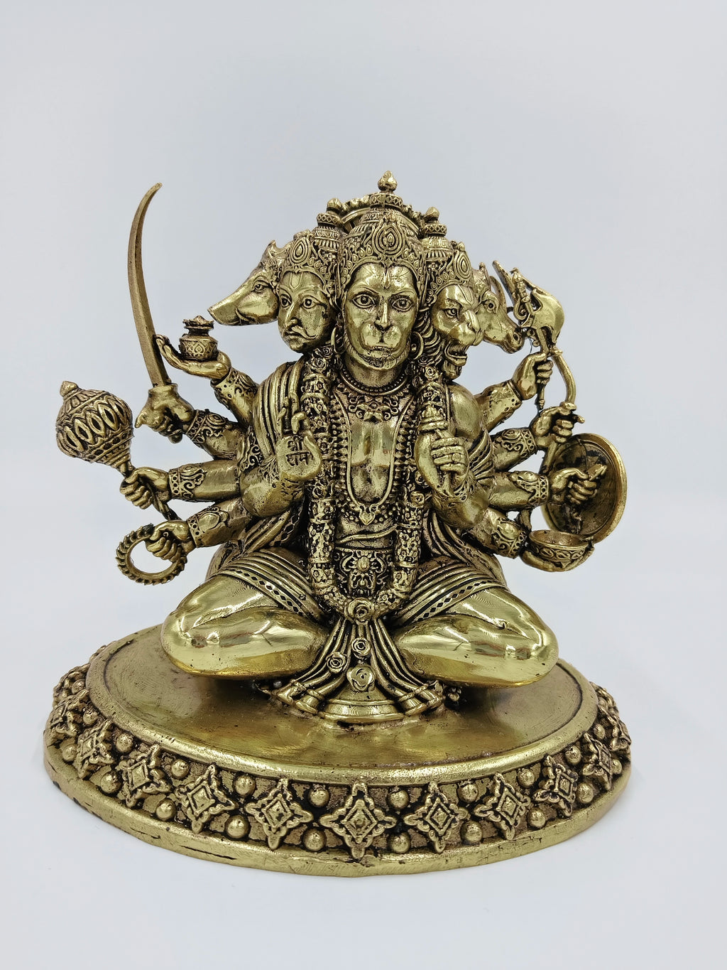 medium brass Panchamukhi Hanuman statue seated on decorated base