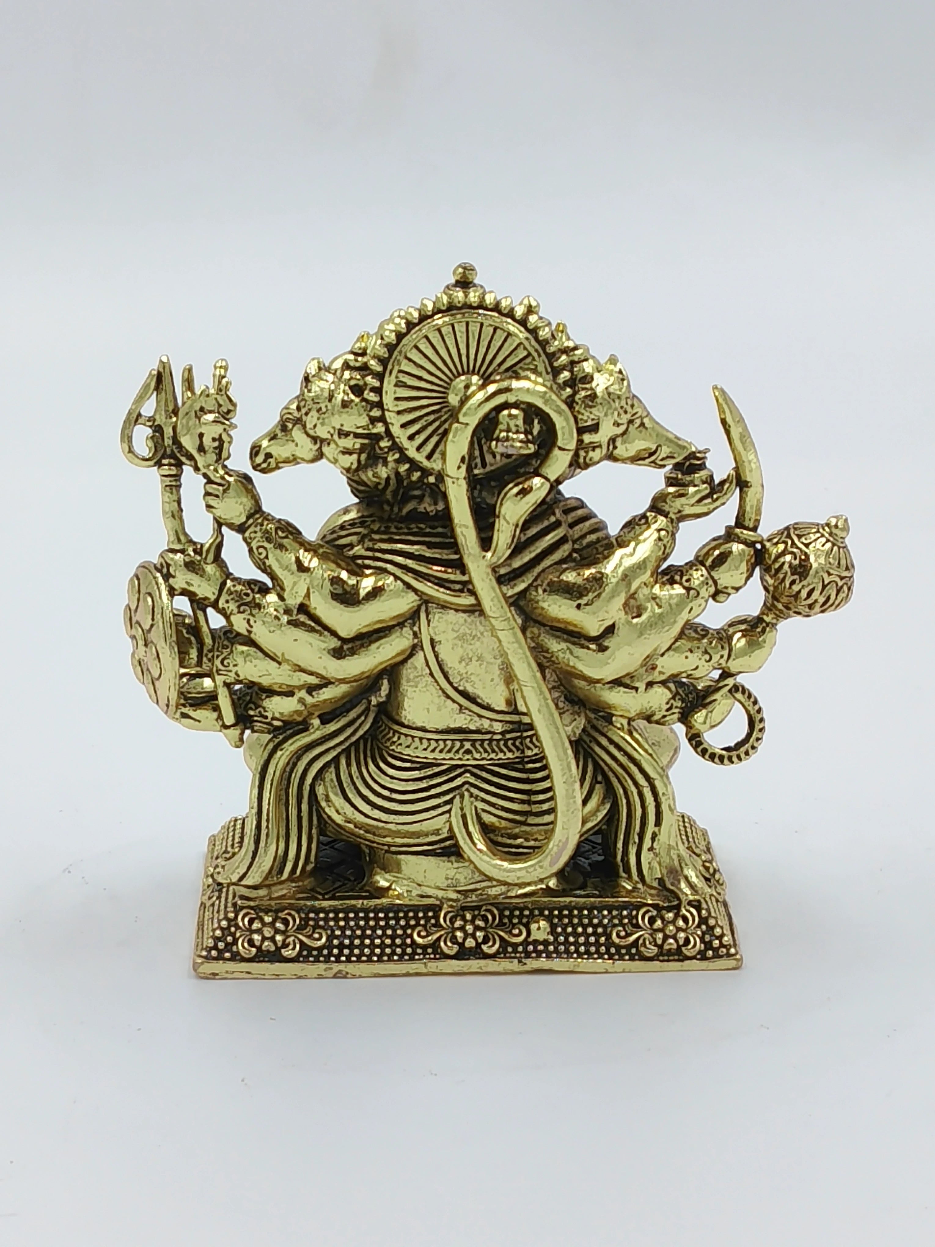 Back view of a small brass Panchamukhi Hanuman statue with five faces and multiple arms