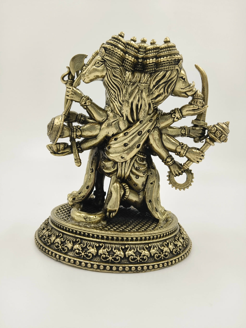 Brass Panchamukhi Hanuman statue with five faces and multiple arms holding weapons
