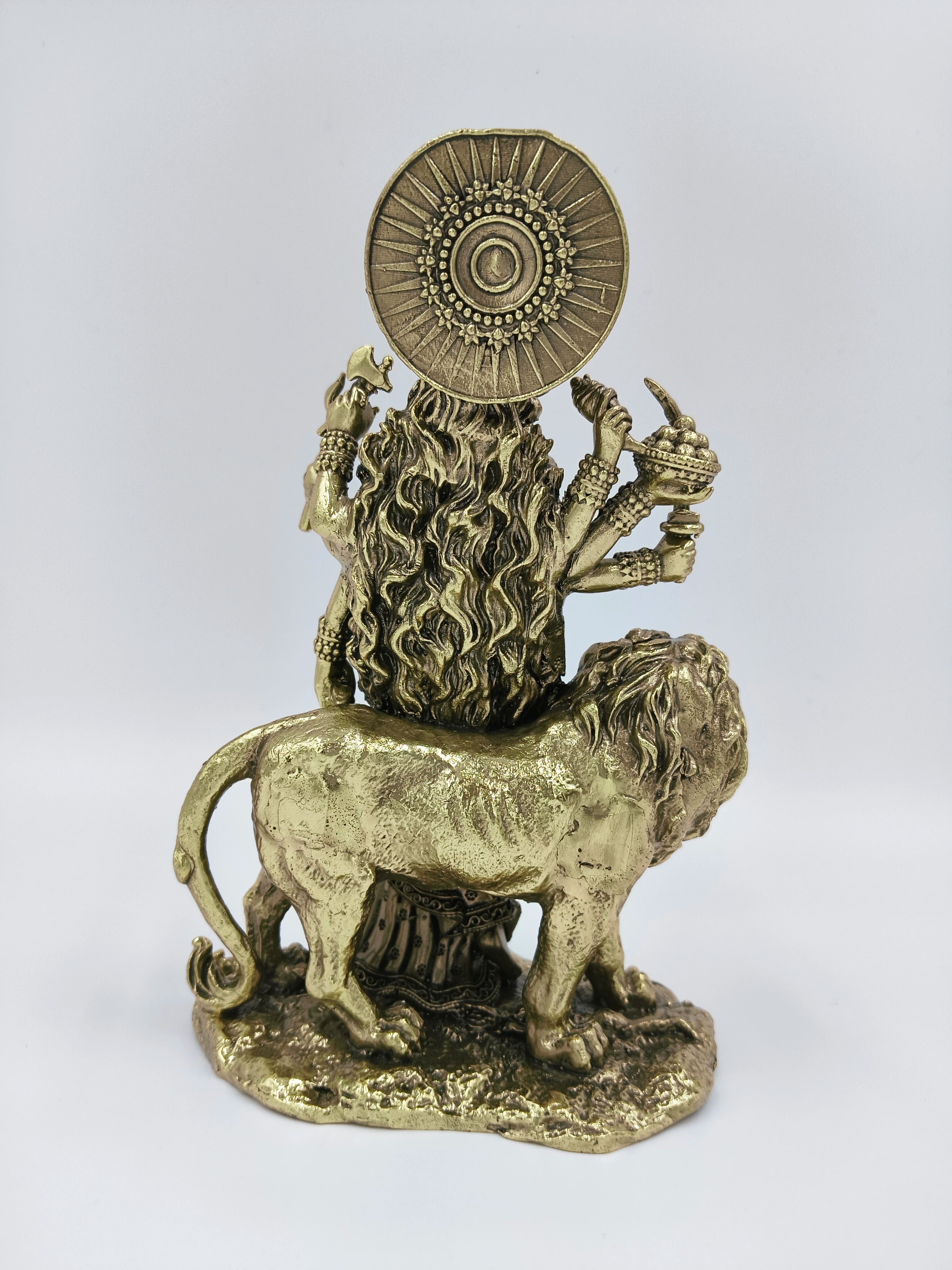 Rear view of medium brass Durgeshwari statue with lion and multiple arms
