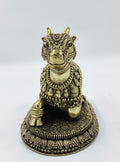 Small brass sculpture of Nandikeshwara bull adorned with decorative engravings