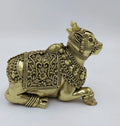 Large brass Nandideva sculpture with intricate floral and bead details side view