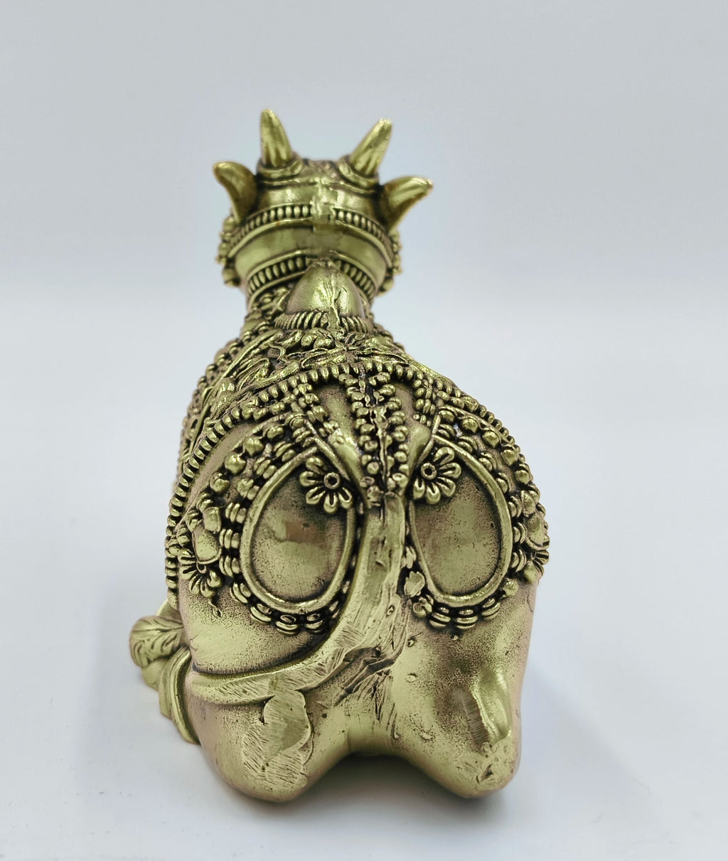 Back view of large brass Nandideva sculpture with intricate detailing
