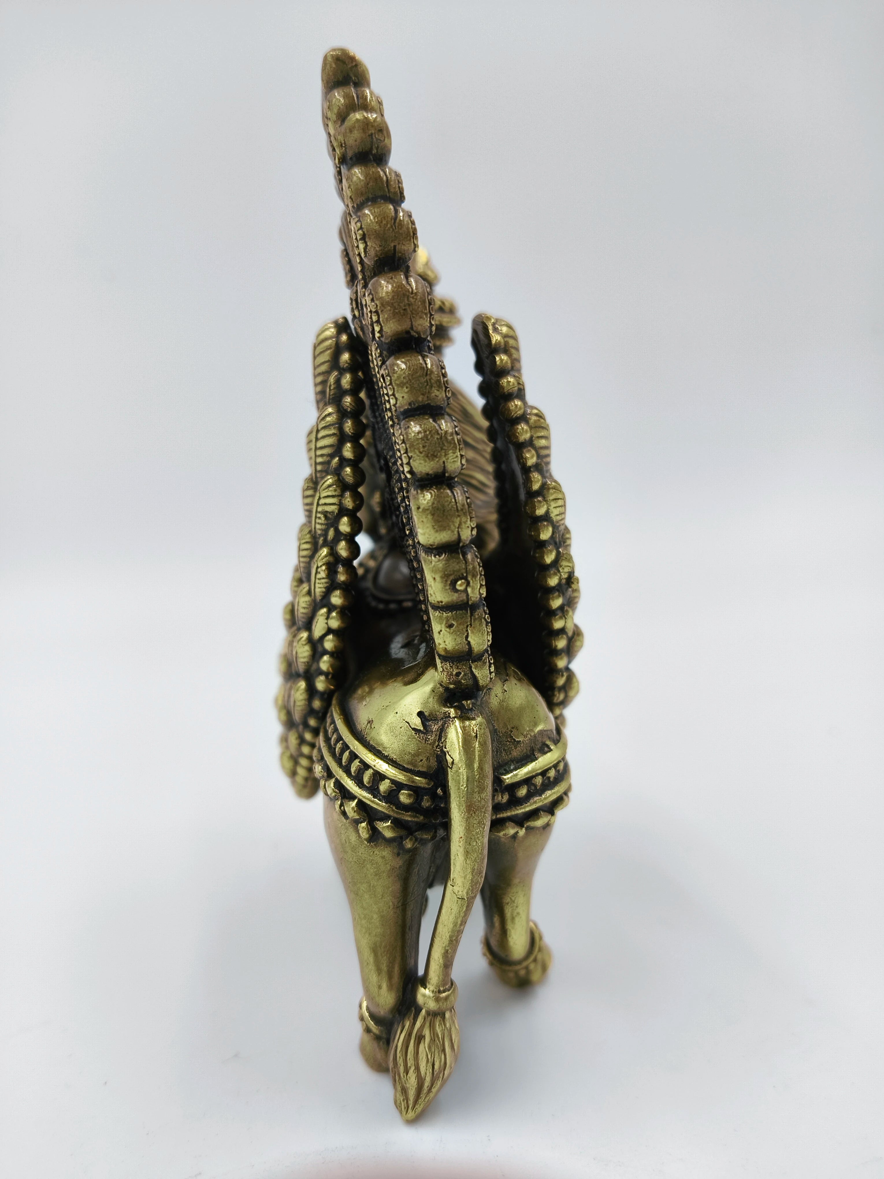 Rear view of medium brass Kamadhenu sculpture with detailed tail and ornamentation