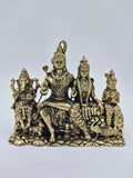 Brass sculpture of Shiva with Parvati, Ganesha, and Kartikeya seated on a stone-like base