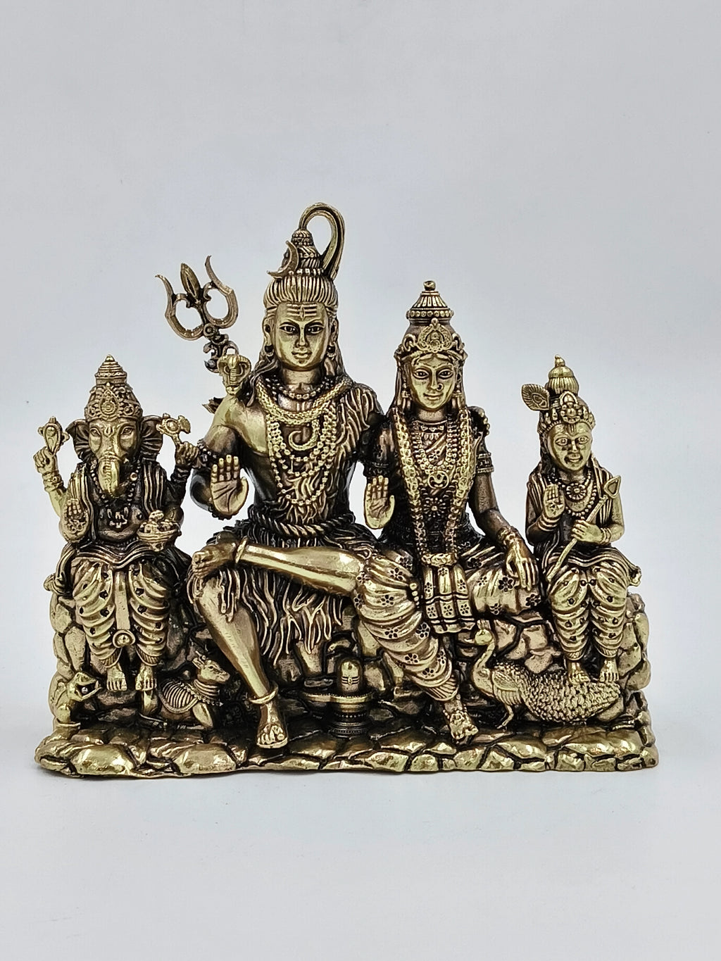 Brass statue of Shiv Parivar featuring Shiva, Parvati, Ganesha, and Kartikeya seated