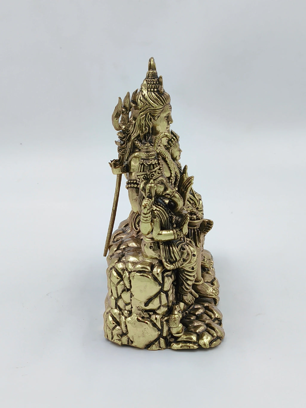 Side view of a medium brass Shiv Parivar sculpture featuring Shiva and family