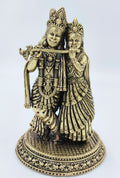 Decorative brass sculpture of Radhakrishna standing on ornate base