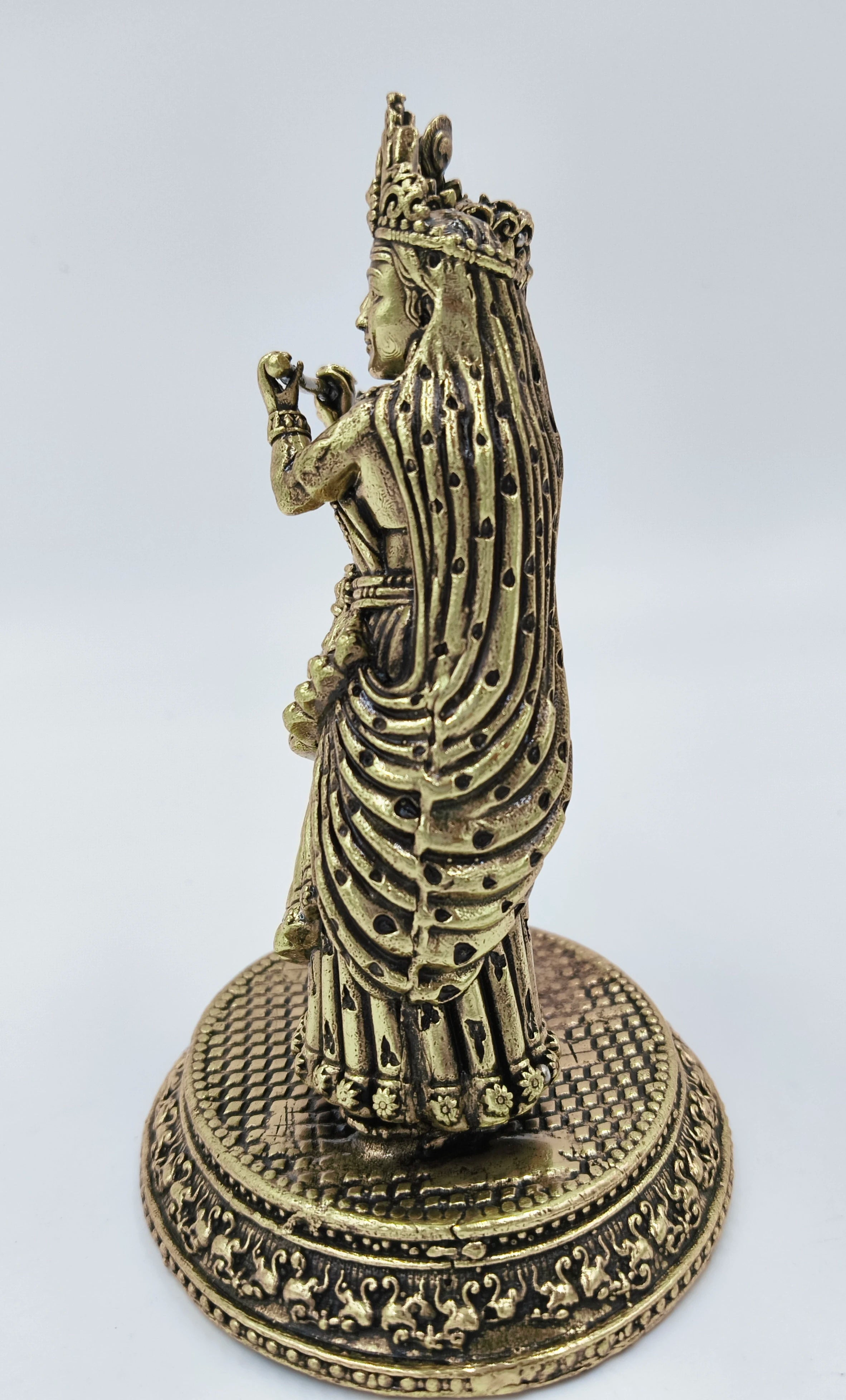 Side view of medium brass Radhakrishna statue with detailed base