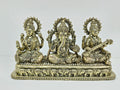 Small brass tabletop statue of Lakshmi, Ganesh, and Saraswathi with elephant motifs