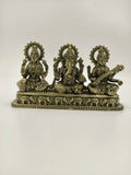 Brass tabletop sculpture of Lakshmi, Ganesh, and Saraswathi seated with decorative base