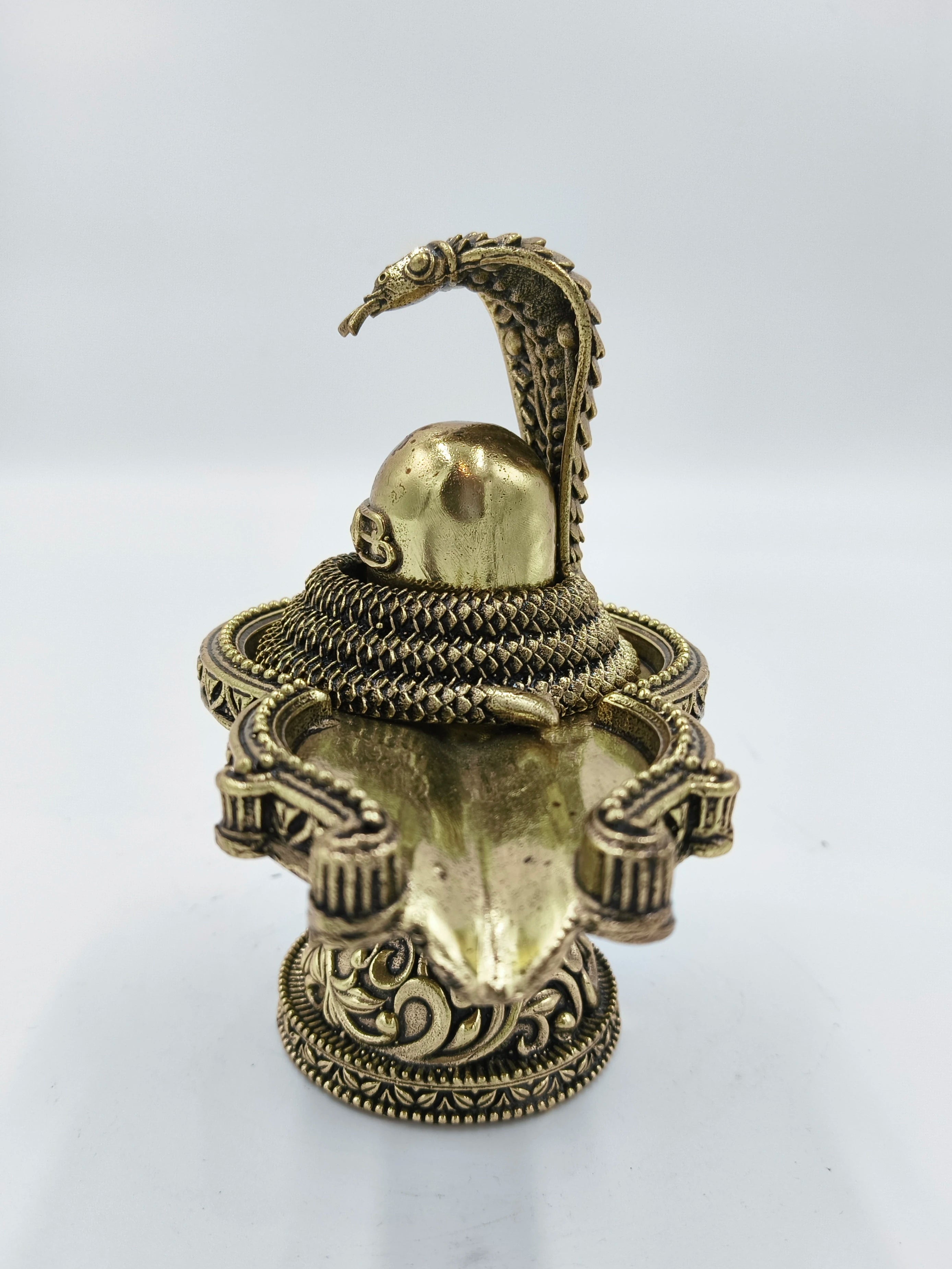 Medium brass Shivalinga sculpture with snake and ornate base detail
