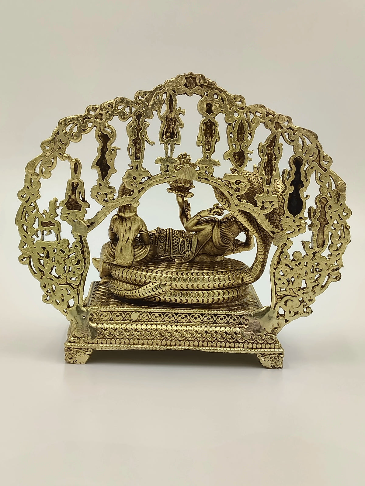 Medium brass sculpture of Vishnu and Lakshmi with ornate decorative arch