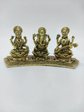 Mini brass statue featuring Lakshmi, Ganesh, and Saraswathi seated on a decorative base
