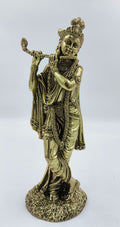 Large brass statue of Krishna playing flute with detailed ornamentation
