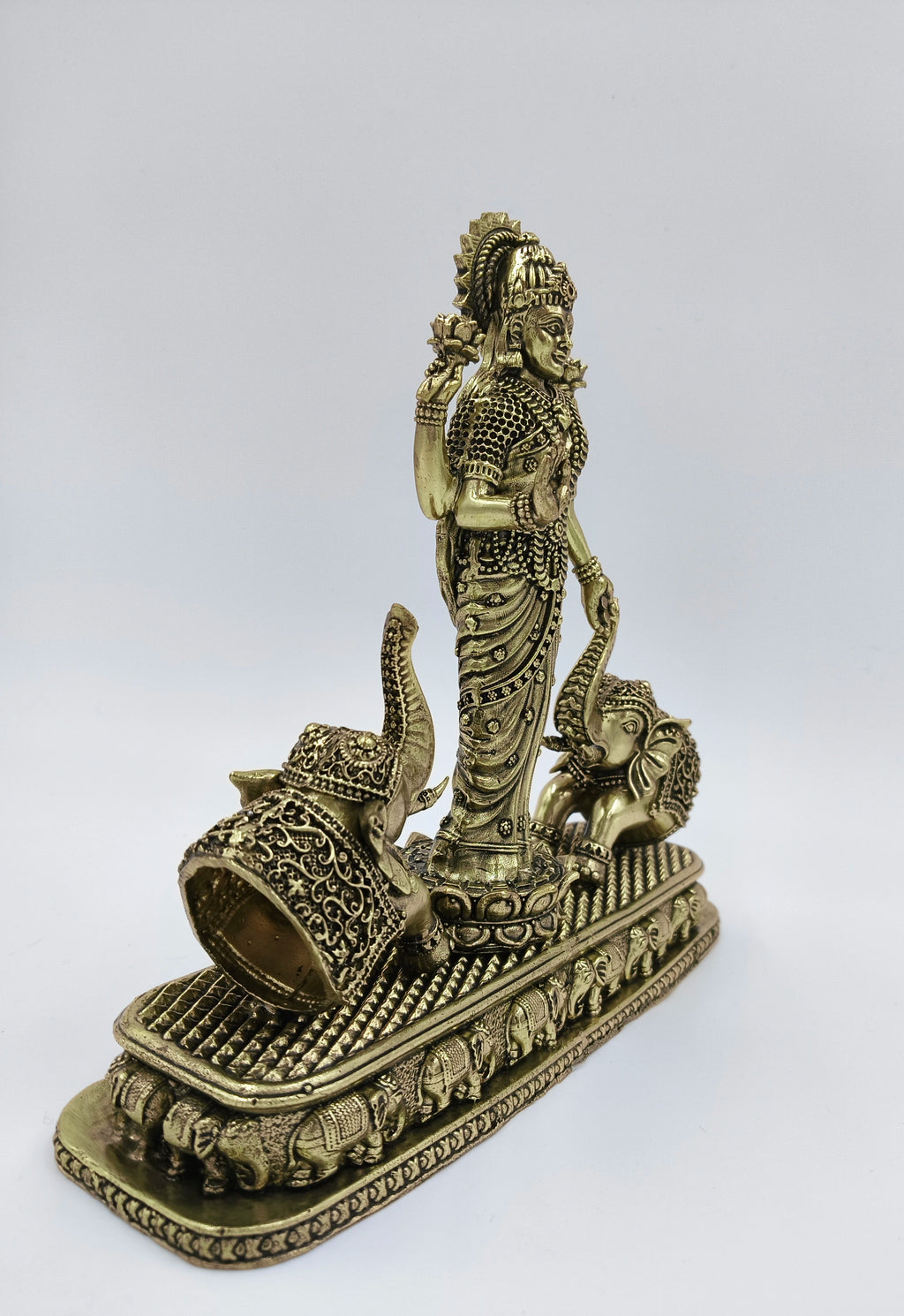 Brass standing Gajalakshmi statue with two decorated elephants on ornate base