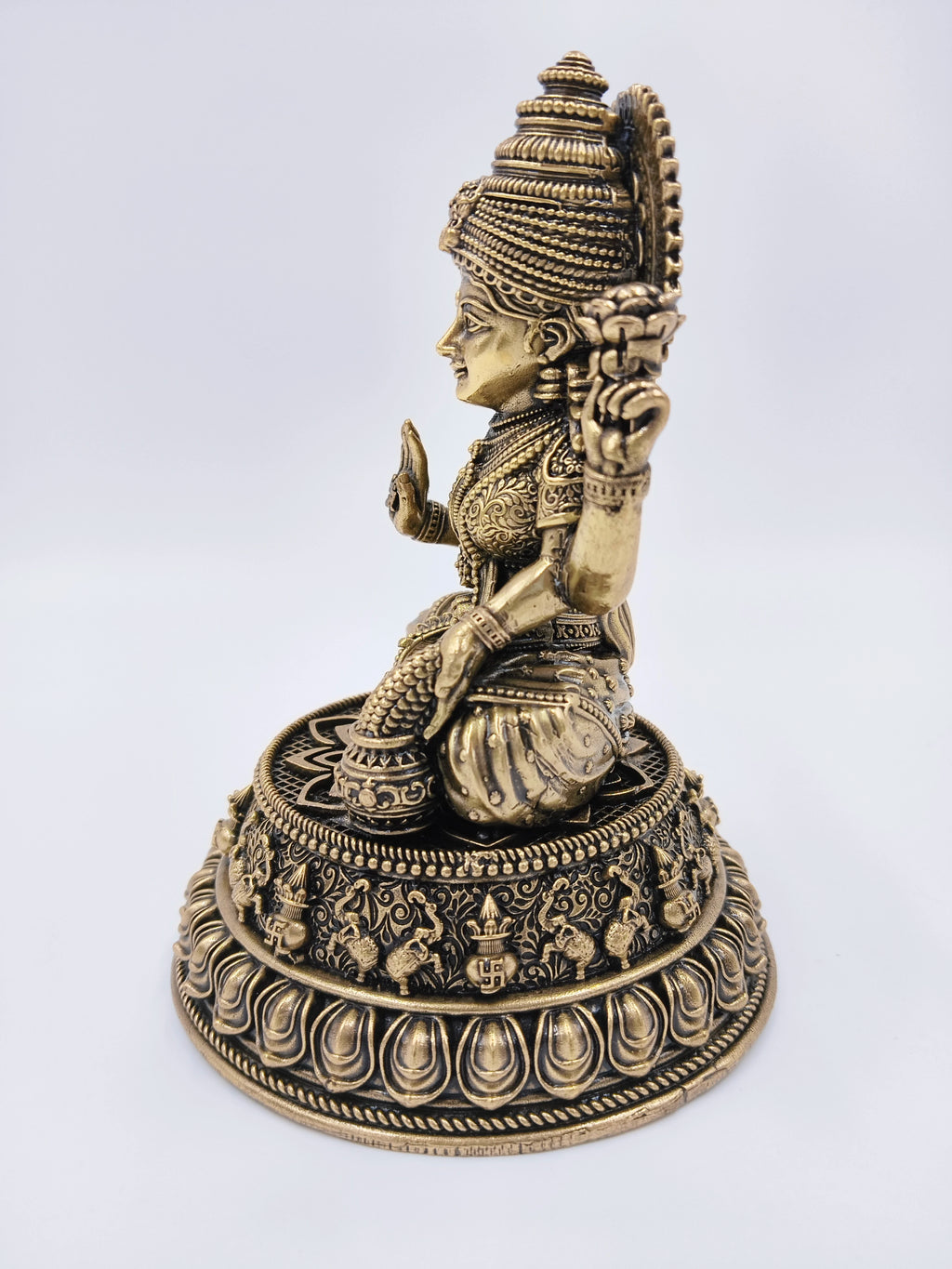 Side view of medium brass Lakshmi Padmini sculpture with intricate detailing