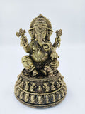 Medium brass sculpture of Siddhi Ganapati with detailed base and seated pose